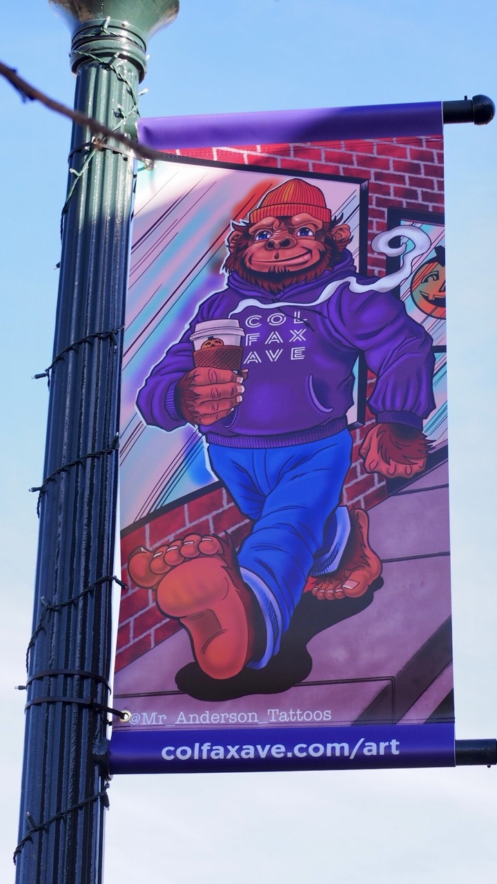 Photo of a tattoo designed street banner on Colfax Ave.