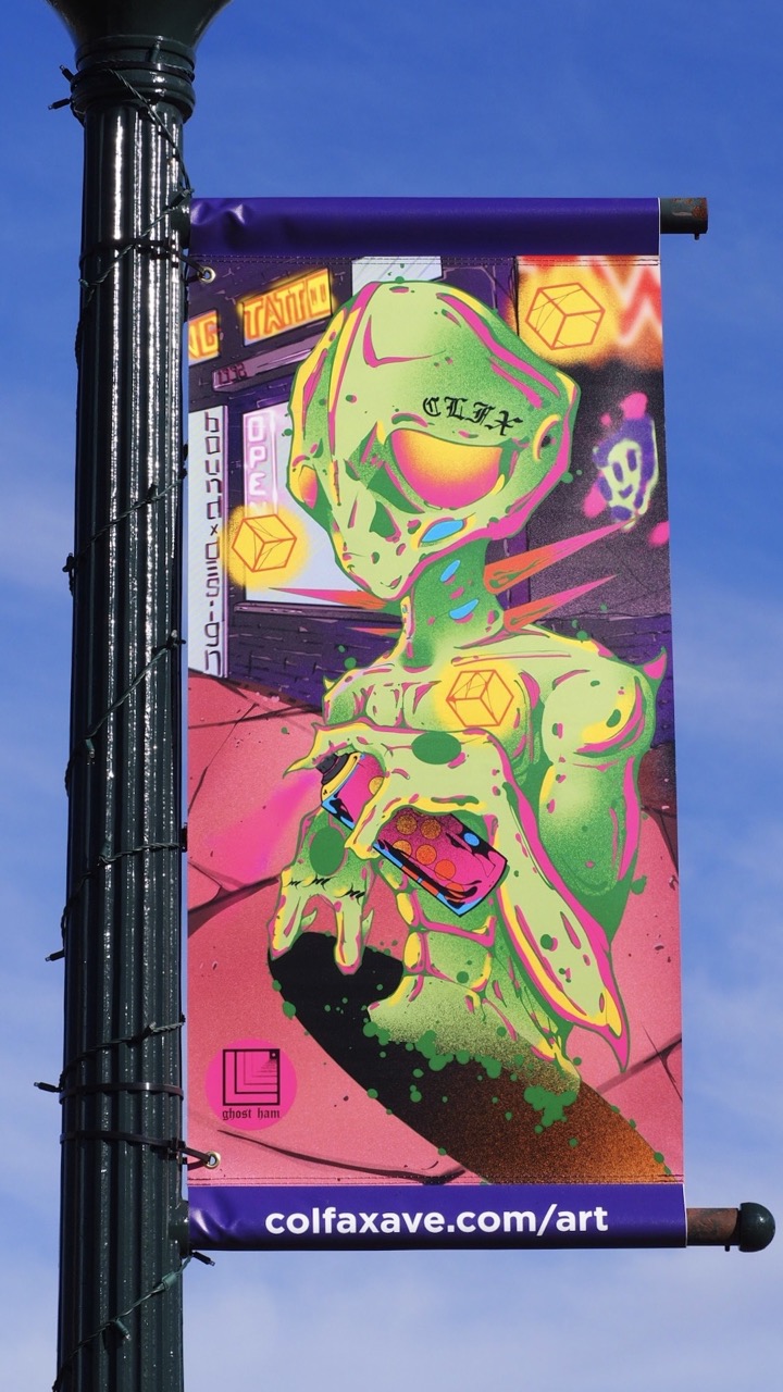 Photo of a tattoo designed street banner on Colfax Ave.