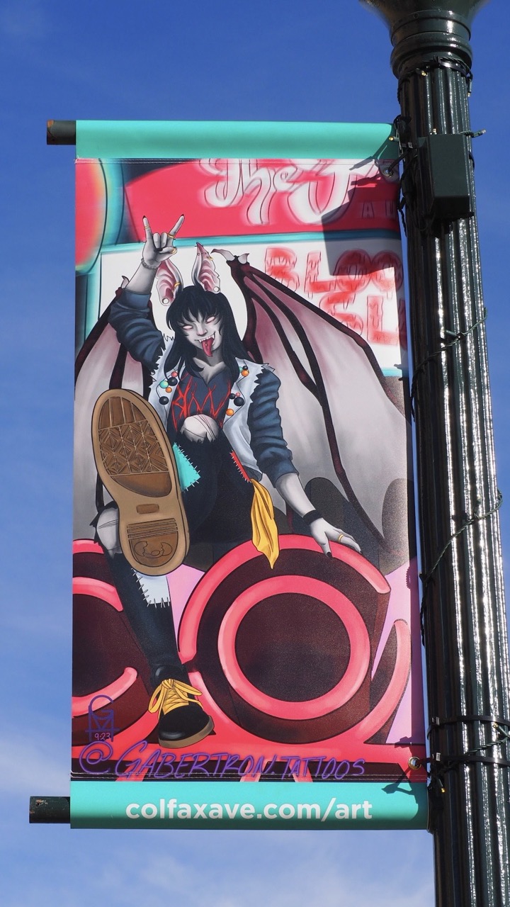 Photo of a tattoo designed street banner on Colfax Ave.