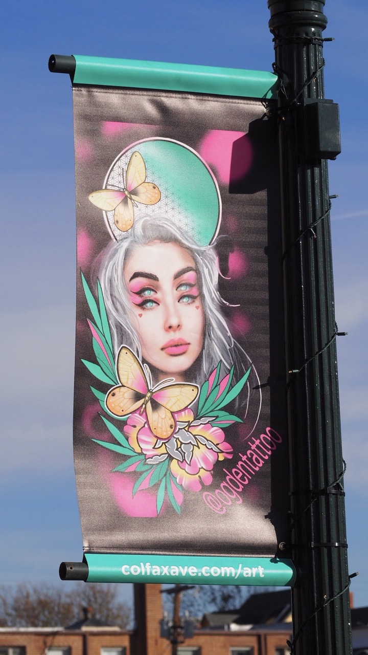 Photo of a tattoo designed street banner on Colfax Ave.